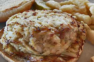 crab cake on roll with french fries